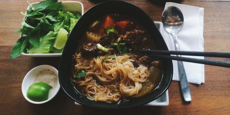 Vietnamese beef pho served with garnishes