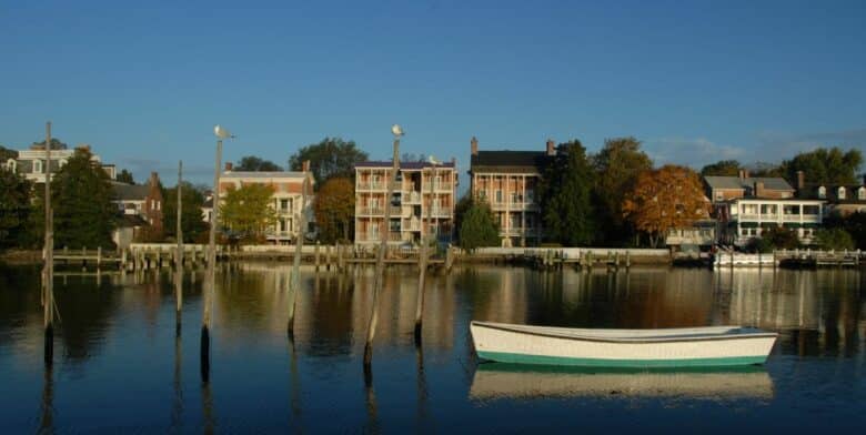 a small boat and shoreline buildings along shore at chestertown md