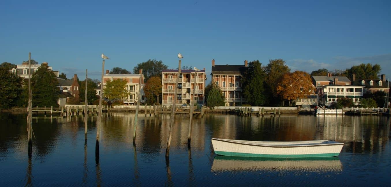 a small boat and shoreline buildings along shore at chestertown md