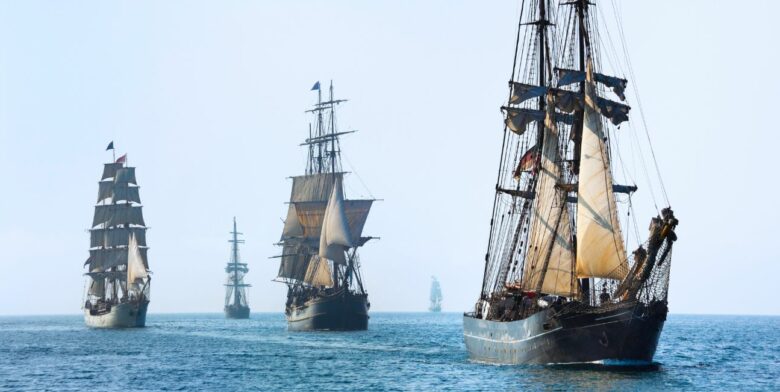 Tall downrigging ships sailing on the ocean