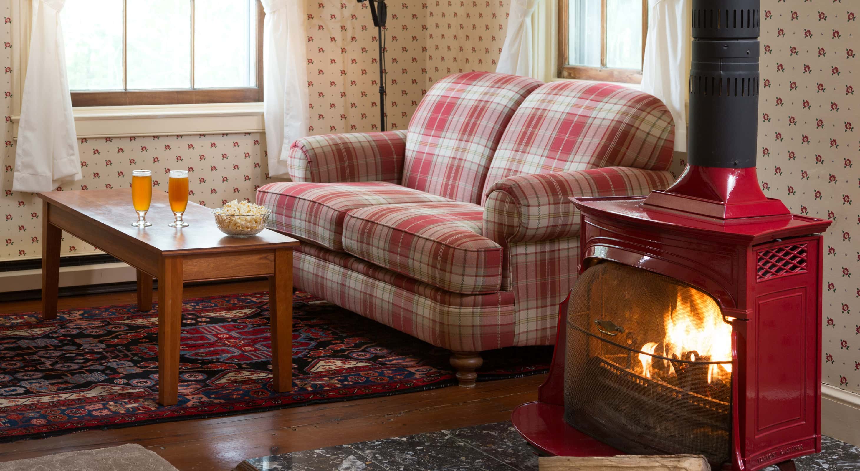 Cozy up next to the wood burning stove in the Red Room, a perfect winter getaway