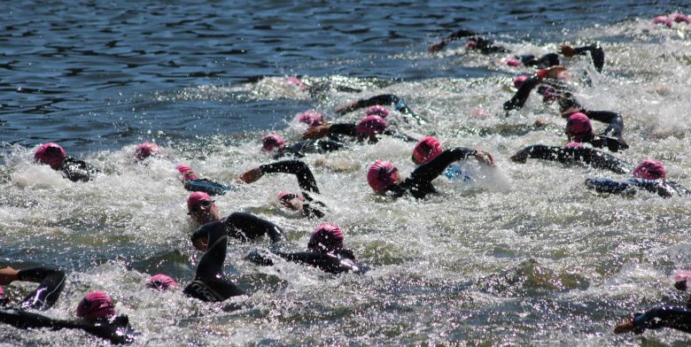 Group of swimmers in semi rough water