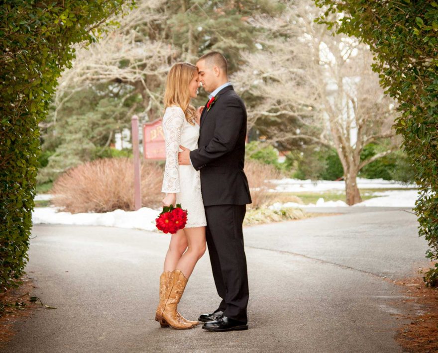 Bride and groom under a canopy of trees