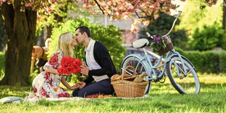Couple Kissing During Romantic Picnic