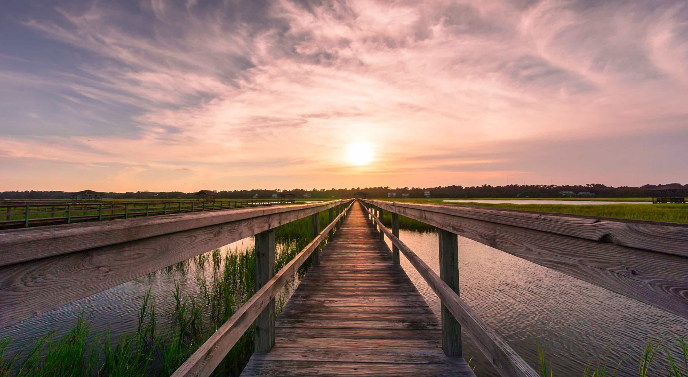 Sunset hike in Maryland over a marsh boardwalk