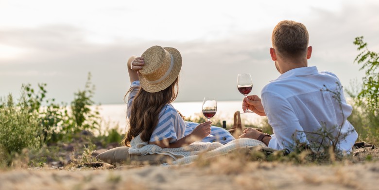 Couple enjoying wine on the beach in Maryland