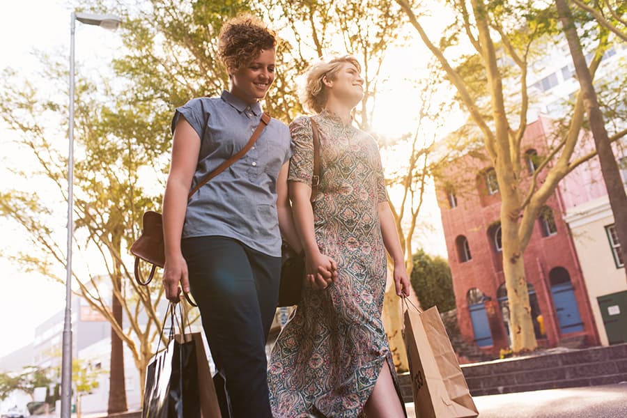 Couple walking down the sidewalk while shopping in Maryland