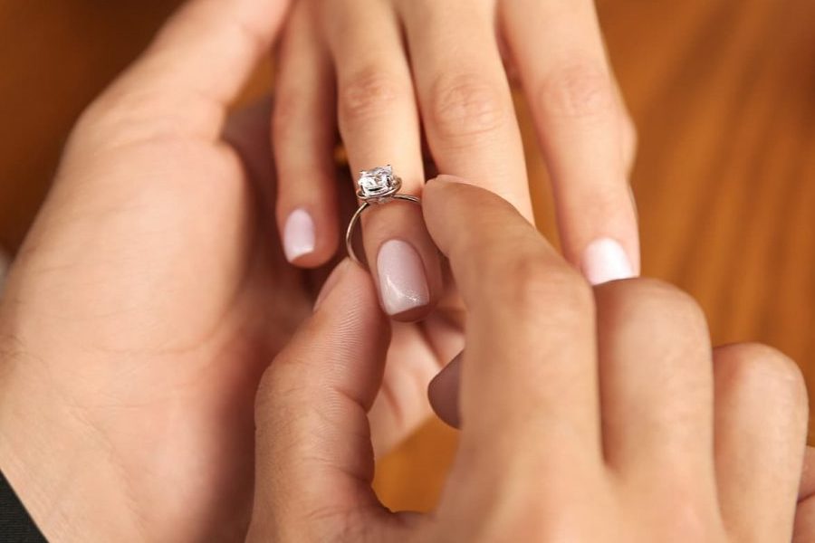 putting on an engagement ring