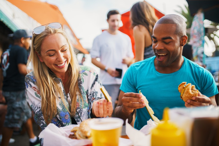 couple dining outside and laughing