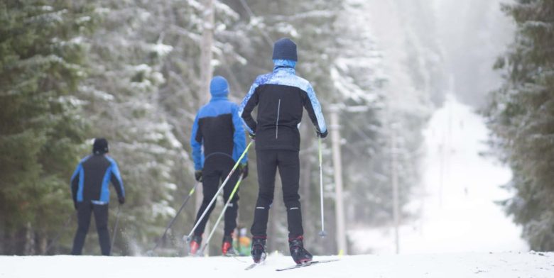 A group of people cross country skiing