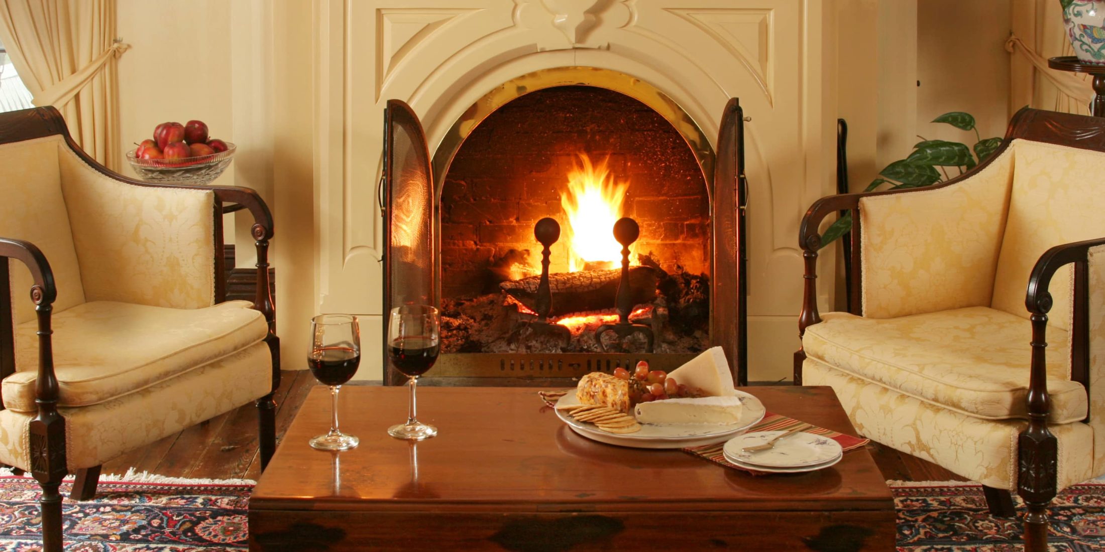 cozy fireplace with wine at our Maryland Inn