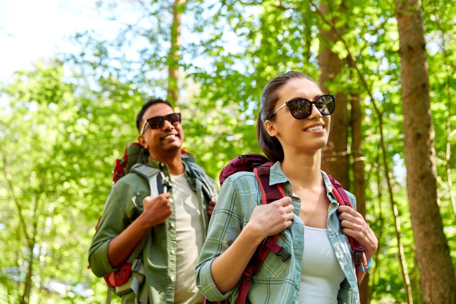 a couple hiking through woods near chestertown