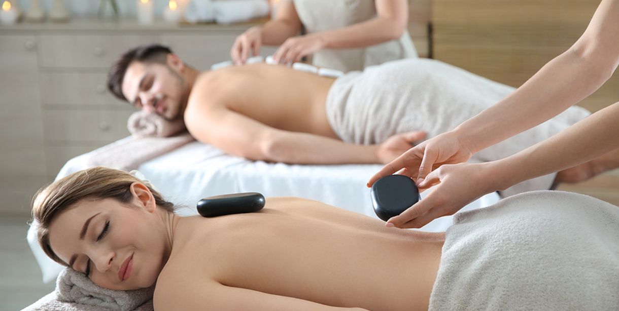 Couple receiving a hot-stone massage