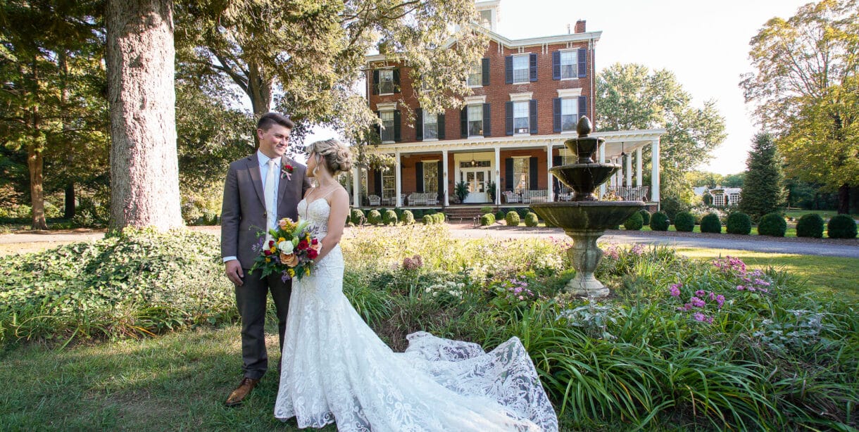 Bride and Groom in front lawn of Brampton 1860 with manor house in background