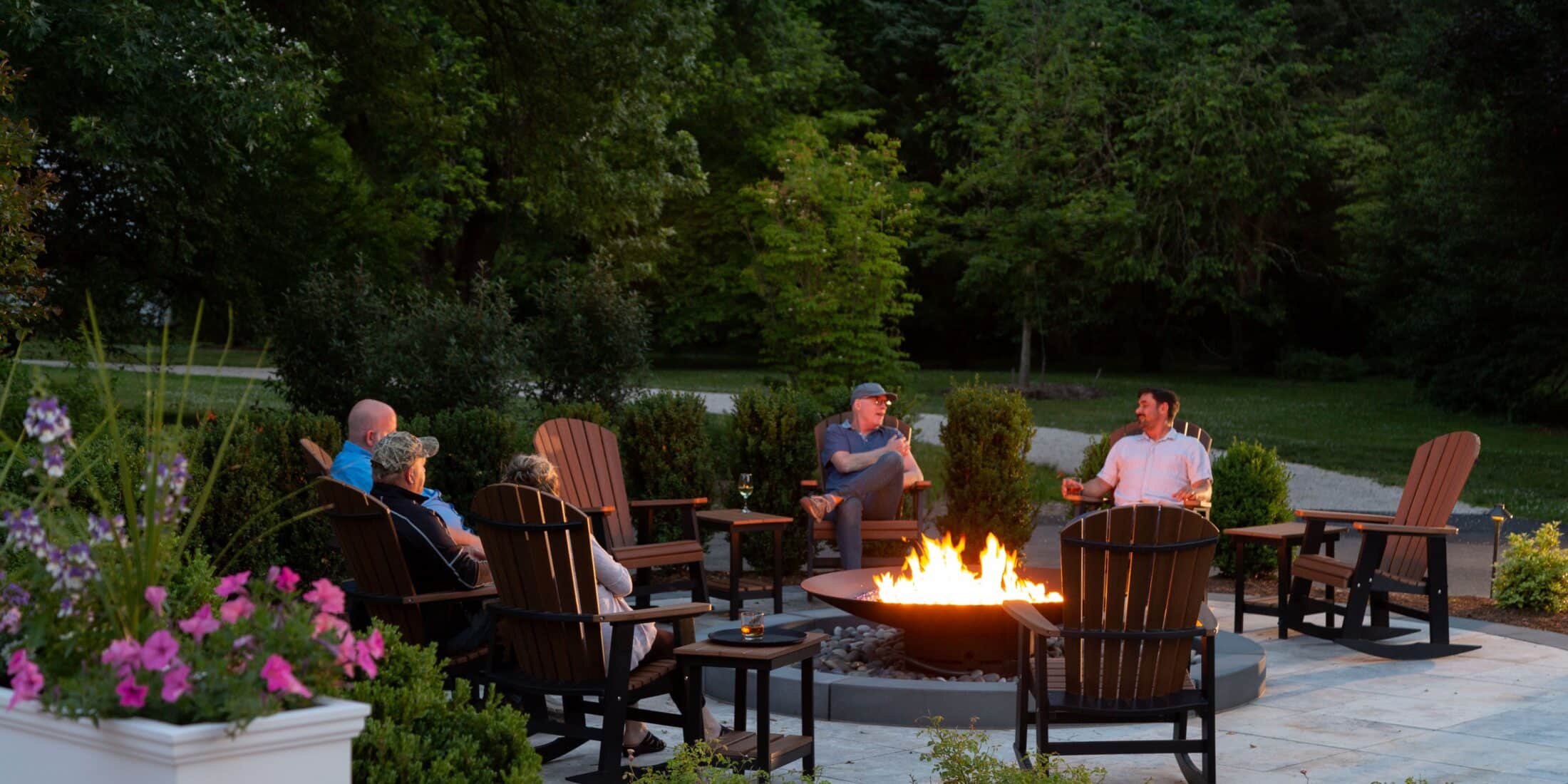 people sitting around firepit at Brampton 1860